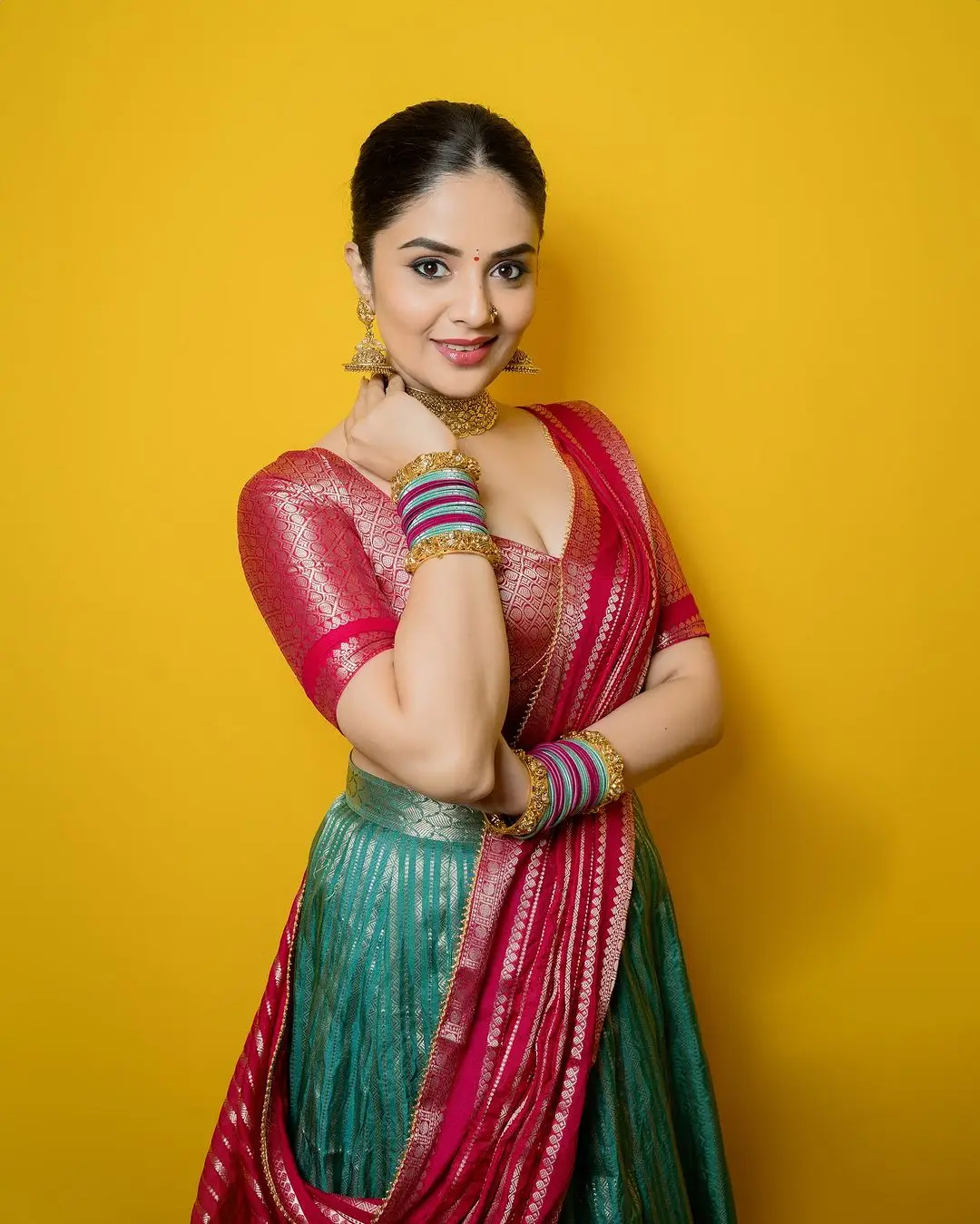 Telugu Actress Sreemukhi Stills In Green Lehenga Choli